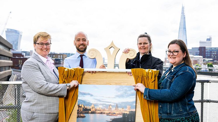 Stunning view: (From left) Station Manager Vicky O'Reilly, Managing Director of Thameslink Tom Moran and Station Assistant Donna Redding with Barbara Hough as she unveils her photograph of London Blackfriars train station (more to download below)