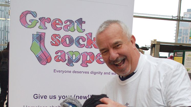 Welcome winter warmers: Spires' charity CEO Nigel Carpenter was delighted with the overflowing container of socks at East Croydon station