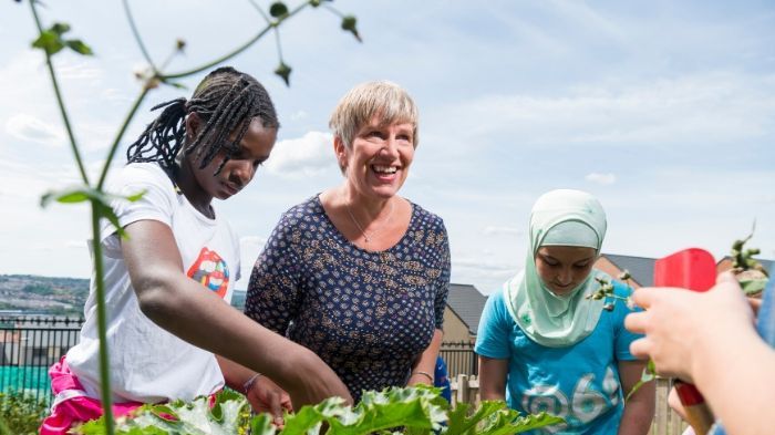 Professor Greta Defeyter talking to some pupils at a school holiday club.