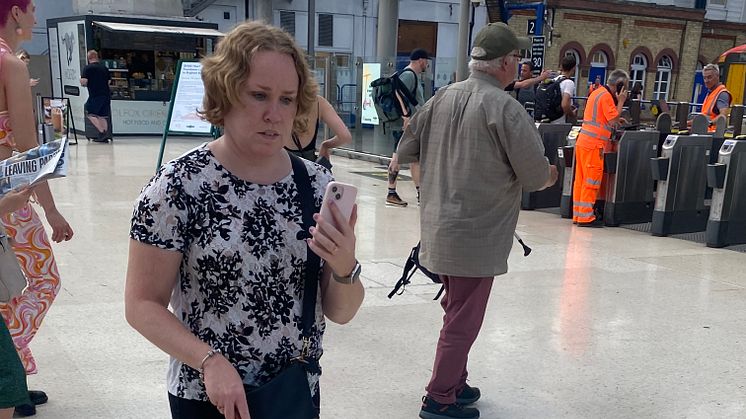 Linn Davies is guided through Brighton station using the Aira app 2