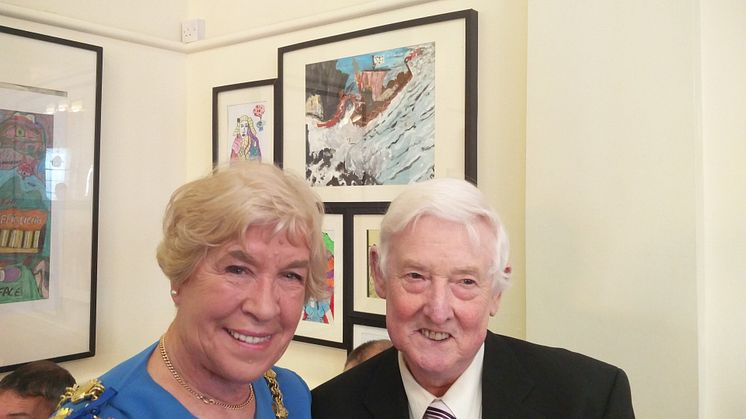 The Mayor of Bury, Cllr Dorothy Gunther, meets artist Dennis Davison whose “Dragon Boat” painting can be seen behind him.