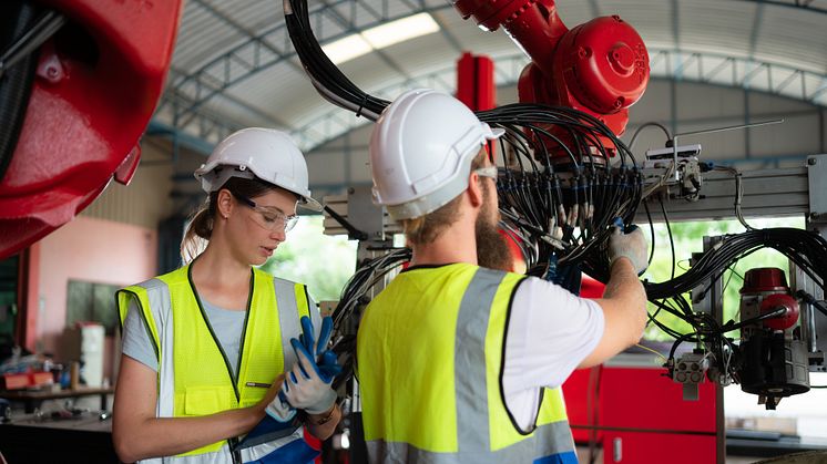 1 Woman and man with robotics - WOSUNA_Shutterstock_2315299093