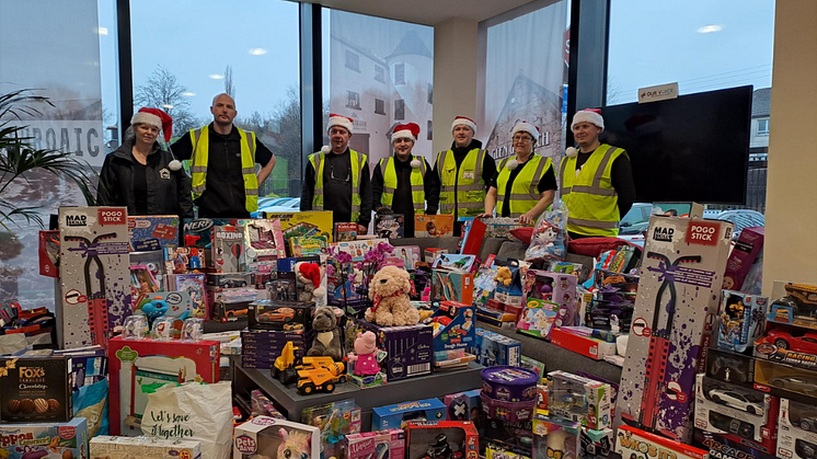 ng homes and Beam Suntory staff members  with some of the donations