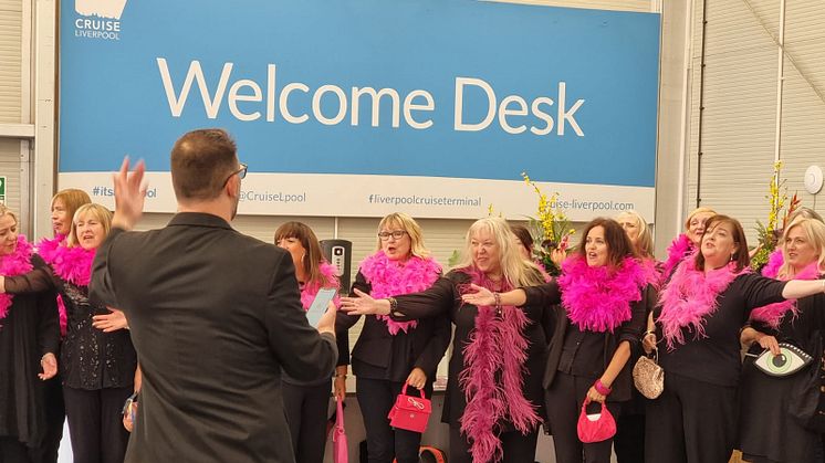 Choir breaks out into song during boarding