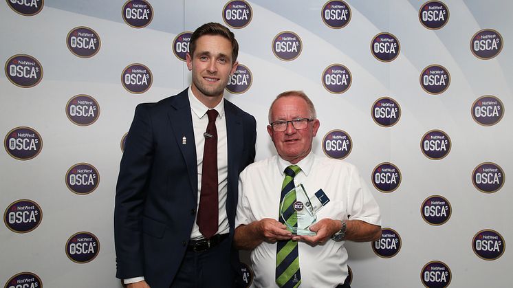 Chris Woakes presents the NatWest Lifetime Achiever OSCA to Ernie Brabbins of Appleby Eden Cricket Club at Lord's