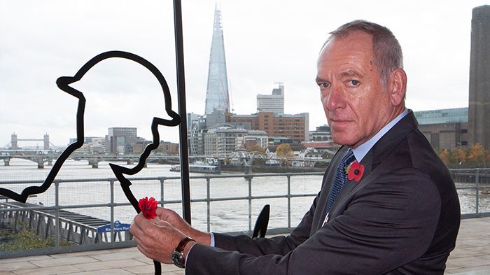 CEO Patrick Verwer places a poppy on a 'There But Not There' outline of a soldier from the First World War at London Blackfriars. GTR hosted events to mark the 100th anniversary of Armistice at stations across its network