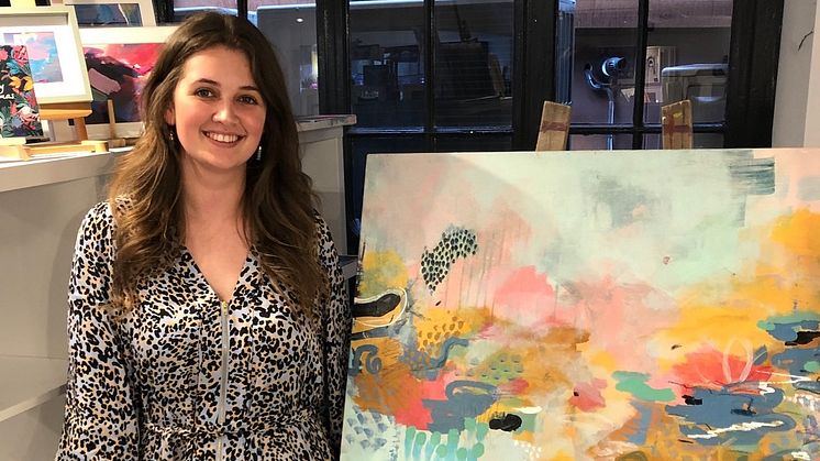 Northumbria alumna Jessica Slack with her artwork 'Finding Life's Joy'