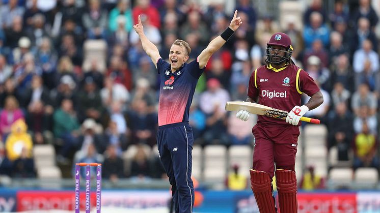 Tom Curran celebrates taking Chris Gayle's wicket on his ODI debut at Southampton earlier this summer. Credit Getty Images/Michael Steele