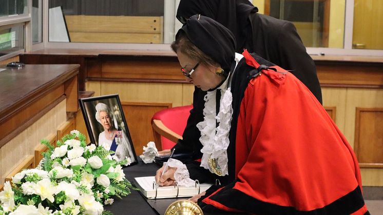The Mayor of Bury, Councillor Shaheena Haroon, signs the Book of Condolence