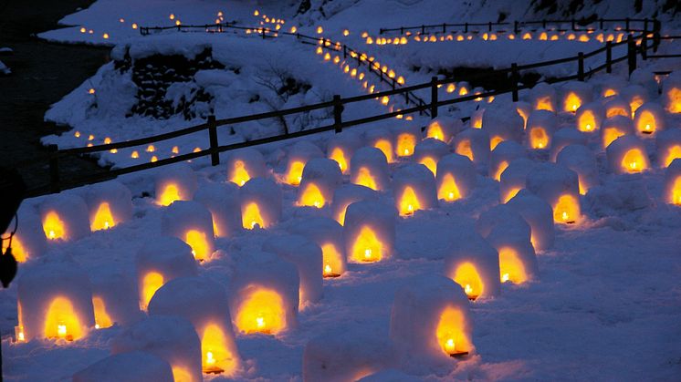 Snow Huts at Yunishigawa Onsen Aglow Past Dusk