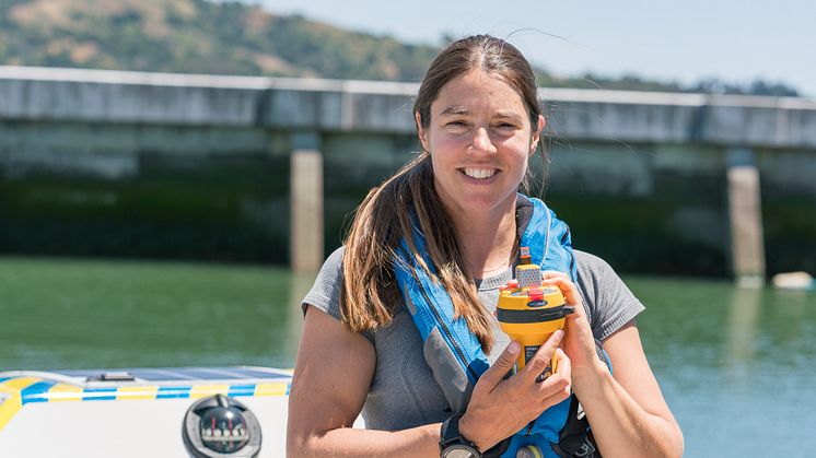 Hi-res image - Ocean Signal - North Pacific solo rower Lia Ditton with her Ocean Signal SafeSea E100G EPIRB