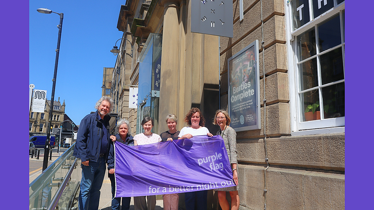 From Left to right; Two members of the Street Pastor team, Jill Youlton, Victoria Robinson, Cllr Charlotte Morris and Chief Executive Lynne Ridsdale holding the Purple Flag outside Bury MET