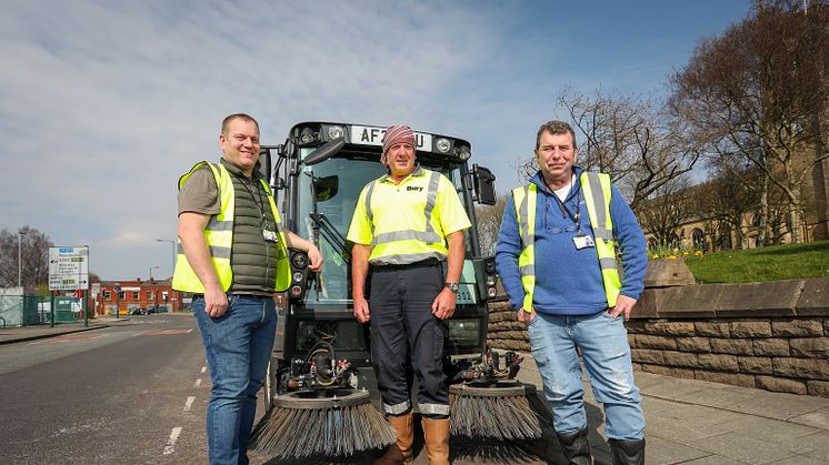 Cllr Quinn with one of the new street sweepers and members of the street care team.