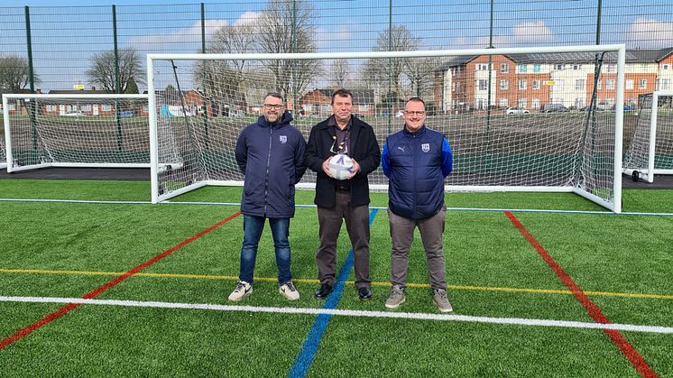 At the 3G pitch are (from left): Paul Hilton (Radcliffe Football Foundation), Councillor Alan Quinn (Bury Council cabinet member), Lee Chapman (Radcliffe Football Foundation).