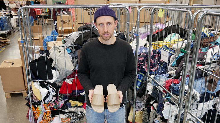 Designer Chris Margetts with the unique 3D-printed shoes made from recycled textiles.