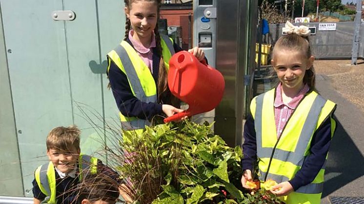 School children have helped improve Angmering station with planters. Similar schemes will be promoted along the route by the new community rail partnership