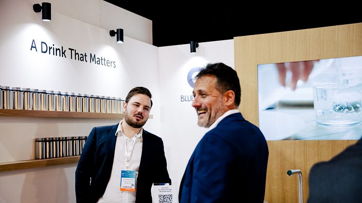 Bluewater booth at Cop28, enjoying a laugh