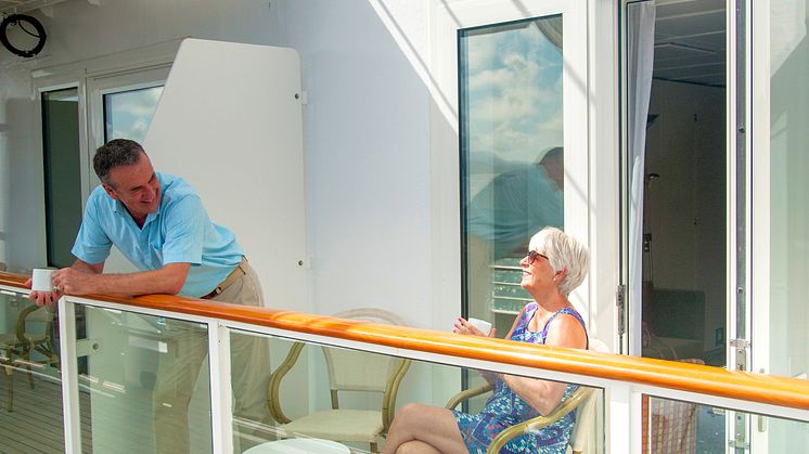 Couple sitting out on Room Balcony 