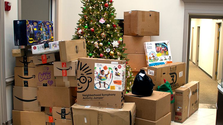 Yanmar America donates Christmas presents to the Good Neighbor Homeless Shelter.