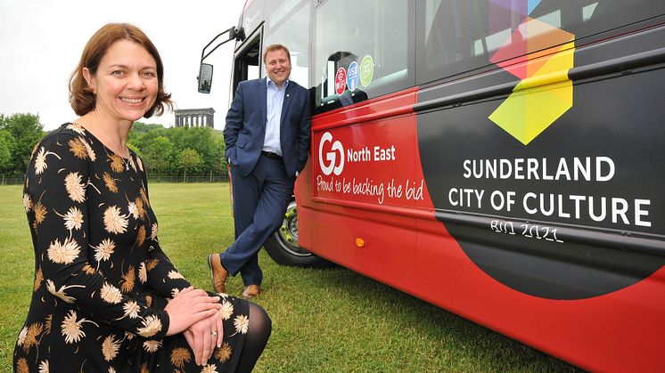 Rebecca Ball and Stephen King with the branded Sunderland 2021 bus at Penshaw Monument