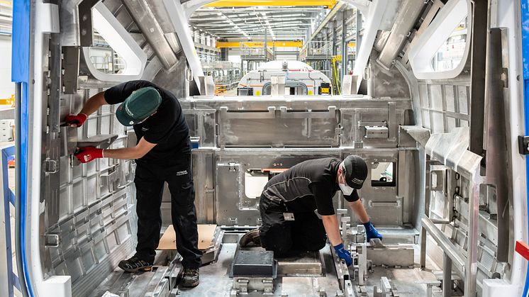 Hitachi production team wear appropriate PPE when manufacturing in Newton Aycliffe