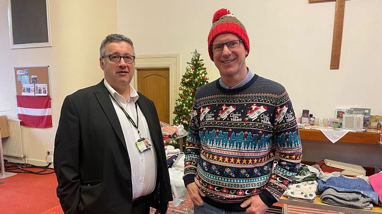 Pictured (from right) Paul shows Cllr Gold around the food club and the clothes shop