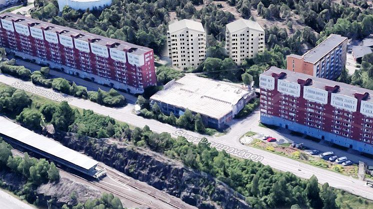 Bilden är en skiss av hur de föreslagna punkthusen (de vita husen i mitten) kan placeras i förhållande till SKBs nuvarande kvarter. Bild: ZIN Arkitektur