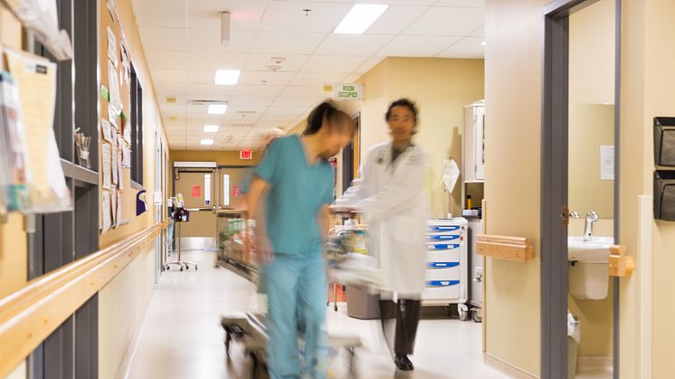 6509225-doctor-and-nurse-pulling-stretcher-in-hospital-corridor.jpg