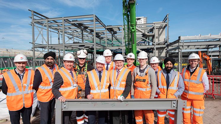 Wolverhampton Interchange partners and apprentices sign one of the steels to be used in the construction of the new railway station building 