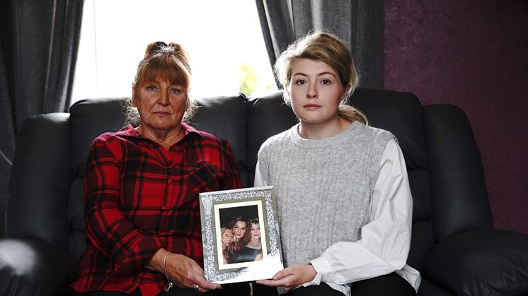 Pictured is the family of Dawn Walker, whose story is told in #Dead2Me. Pictured is mother, Ginny Walker (L), and Dawn Walker’s daughter Keira-Lee Guest (R) (holding a framed photo of Dawn with her two sisters)