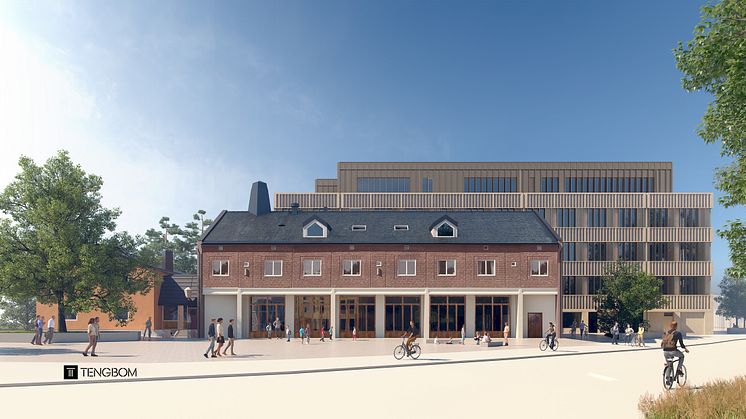 Hägerstensborna känner igen den typiska brandstationsfronten mot gatukorsningen. I bakgrunden reser sig den nästan kubformade nybyggnationen. Bild: Tengbom Arkitekter