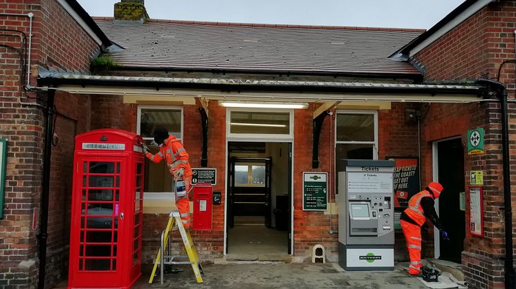 Workmen refurbish the street-level ticket hall