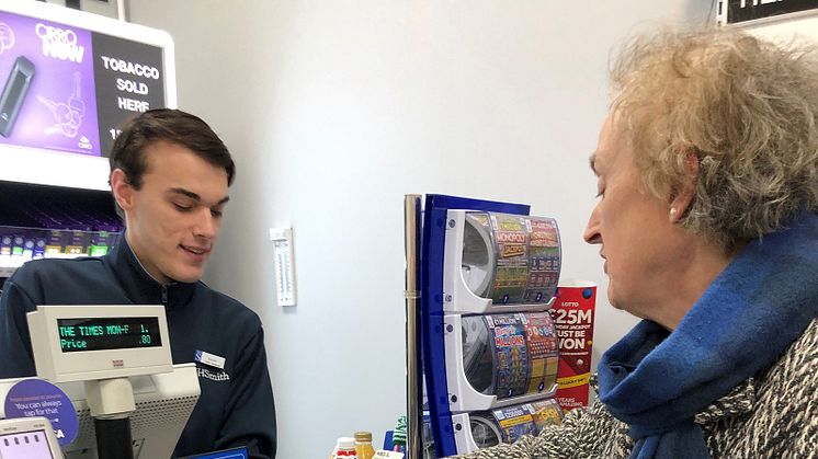 Here is the news: Thornton Heath resident Carol Thompson picks up her morning paper from WHSmith's Joseph Howard at the station's new store