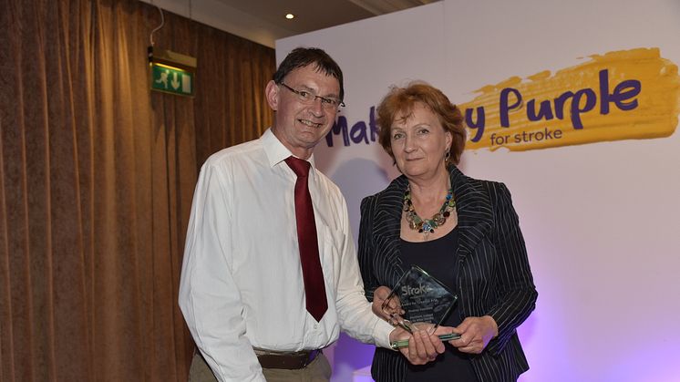 Rodney Hamilton receives his Creative Arts Award from Roisin McDonough, Chief Executive of the Arts Council NI