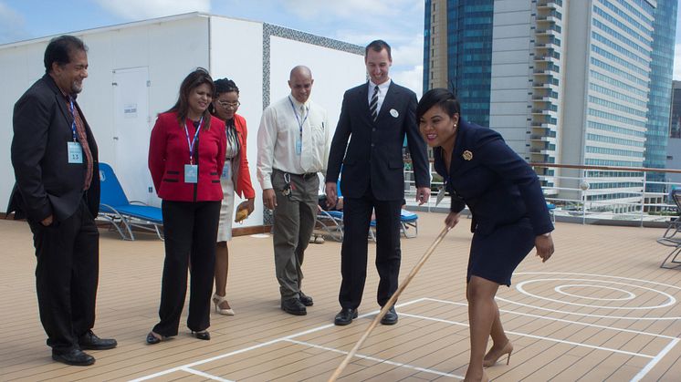 The Minister of Tourism for Trinidad and Tobago, the Honourable Shamfa Ashaki Cudjoe, tries her hand at deck shuffleboard during a tour of Fred. Olsen's 'Balmoral' on her maiden call at the Port of Spain, Trinidad on 15th November 2017. 