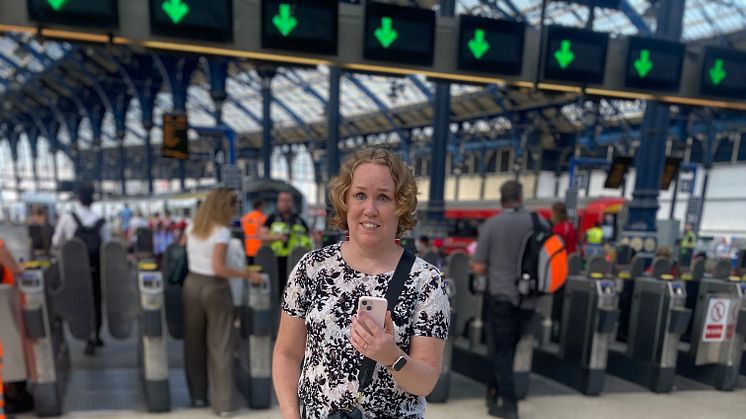 Linn Davies makes contact with an agent on the Aira app at Brighton station