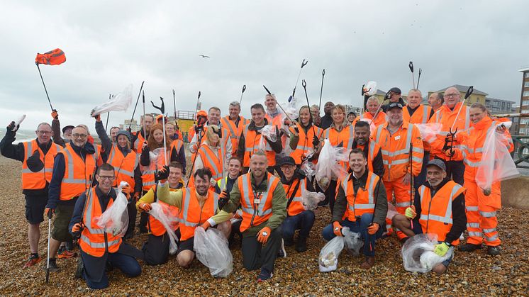 Soaking but happy with a job well done: GTR's Head of Environment Jason Brooker (centre) and the team at Brighton & Hove beach