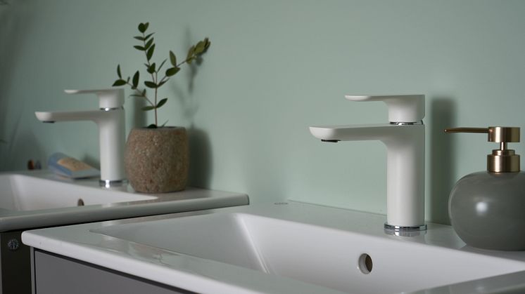 White (matte) Estetic taps on a gray Graphic bathroom cabinets. 