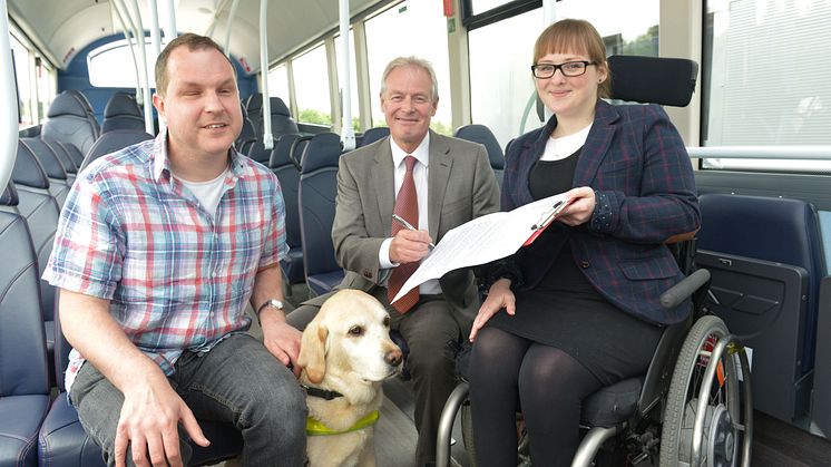 Bus user Angus Huntley and his guide dog Kira with Kevin Carr from Go North East and RNIB's Fran Di Giorgio