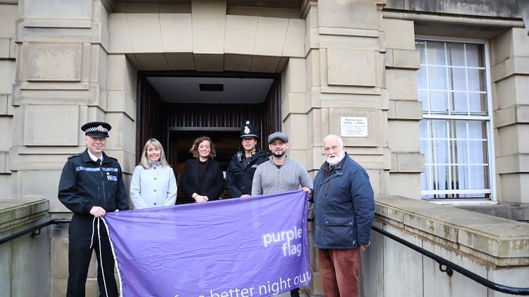 Raising the Purple Flag again (from left) Chief Inspector Jamie Collins (neighbourhoods, Bury North Command area); Victoria Robinson; Cllr Charlotte Morris; Sgt Martyn Bannister; Tom Sharman, chair of Bury Pubwatch and owner of House of Bridget/Eleph