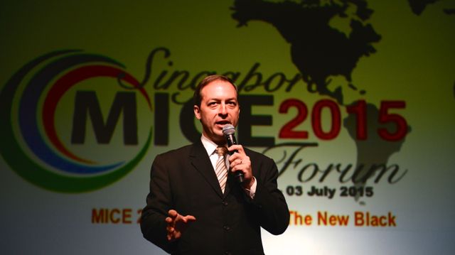 Mark Laudi emceeing at the Singapore MICE Forum 2015