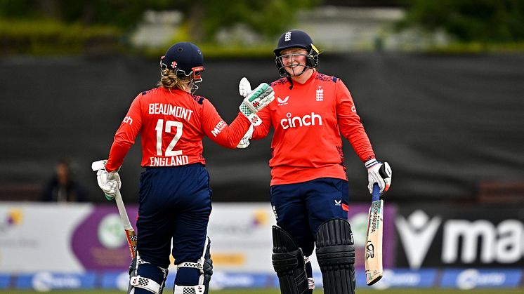 Bryony Smith of England celebrates with team-mate Tammy Beaumont after bringing up her half century. (Photo by Sam Barnes - ECB/ECB via Getty Images)