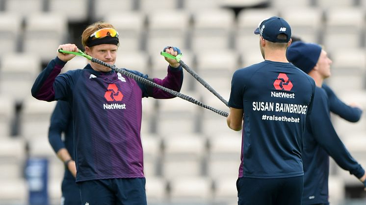 Ollie Pope and Mark Wood of England warm up displaying key workers names on their backs ahead of day one of the 1st #RaiseTheBat Test match at The Ageas Bowl on July 08, 2020 in Southampton, England. (Photo by Stu Forster/Getty Images for ECB)