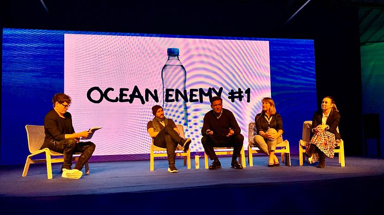 Bluewater Founder and CEO Bengt Rittri (center) explains how Bluewater has put ending the need for single use plastic bottles at the core of its business mission