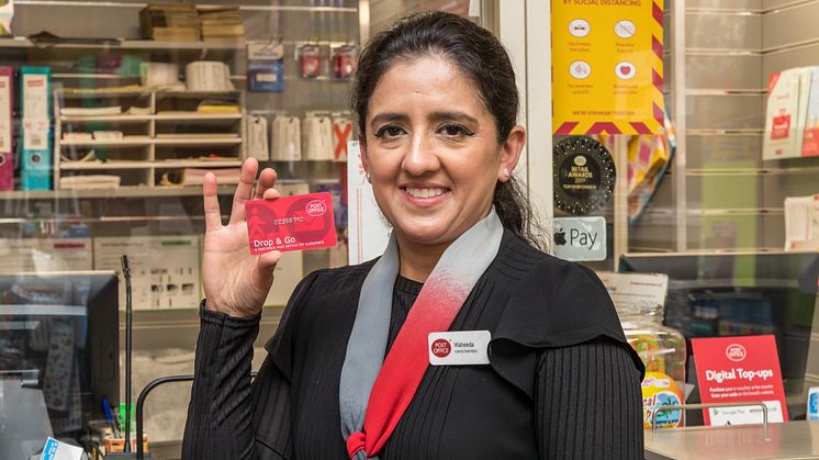 Postmistress Waheeda Akram with Drop & Go card