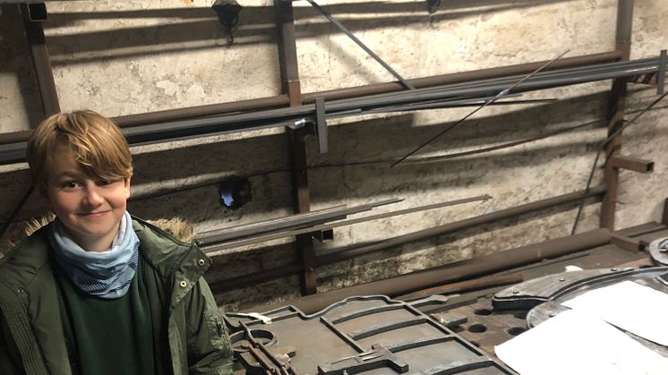 Forging ahead: Monty, 9, checks the blacksmith's progress  on the steel sculpture he designed for Glynde station