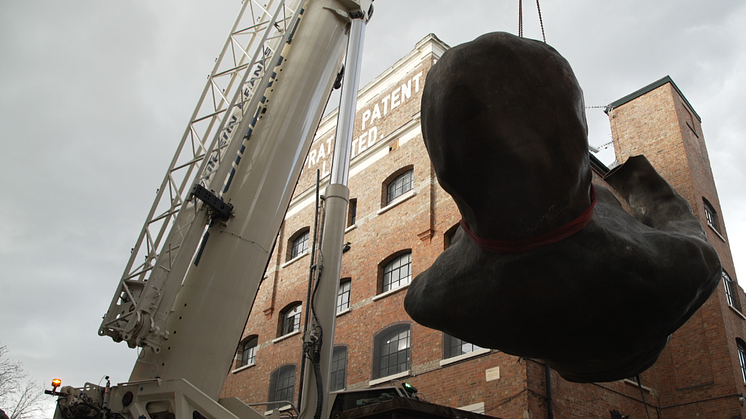 The Mother, one part of the sculpture being lifted in London