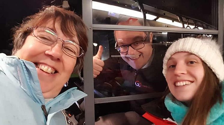 Two happy Lumiere-goers with their friendly Go North East driver