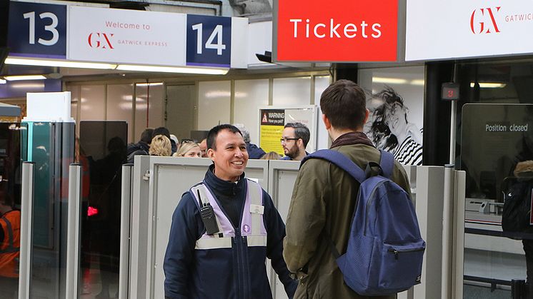 Customer Service Host Antonio Tapia welcomes a passenger at the Gatwick Express portal at London Victoria