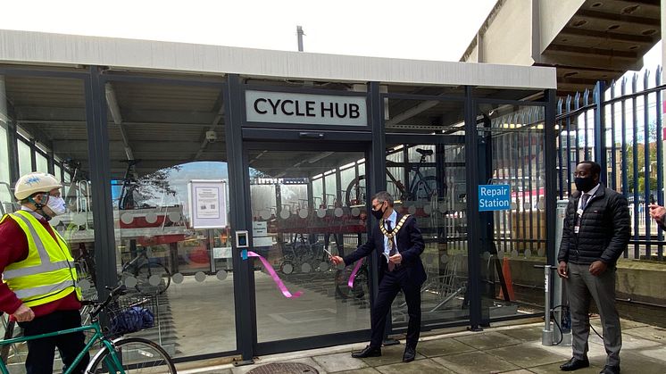 Built for biking: Town Mayor Cllr Simon Rubner officially opens Elstree & Borehamwood station's £200,000 cycle hub, with cyclist John Cartledge (left) and Thameslink Station Manager Marc Asamoah (right) [photo credit Bob Redman]